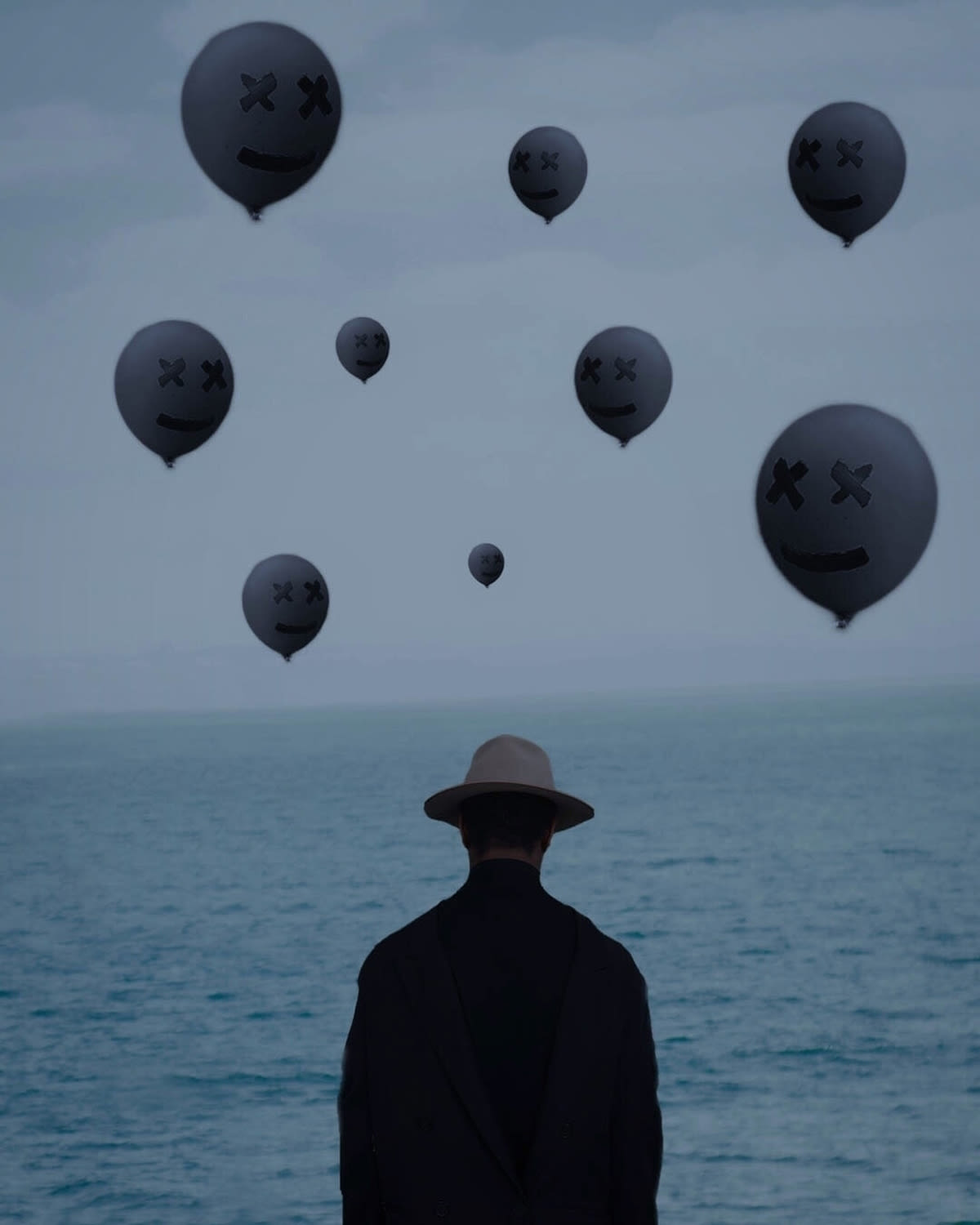 Charles-Etoroma-man-black-balloons.jpg